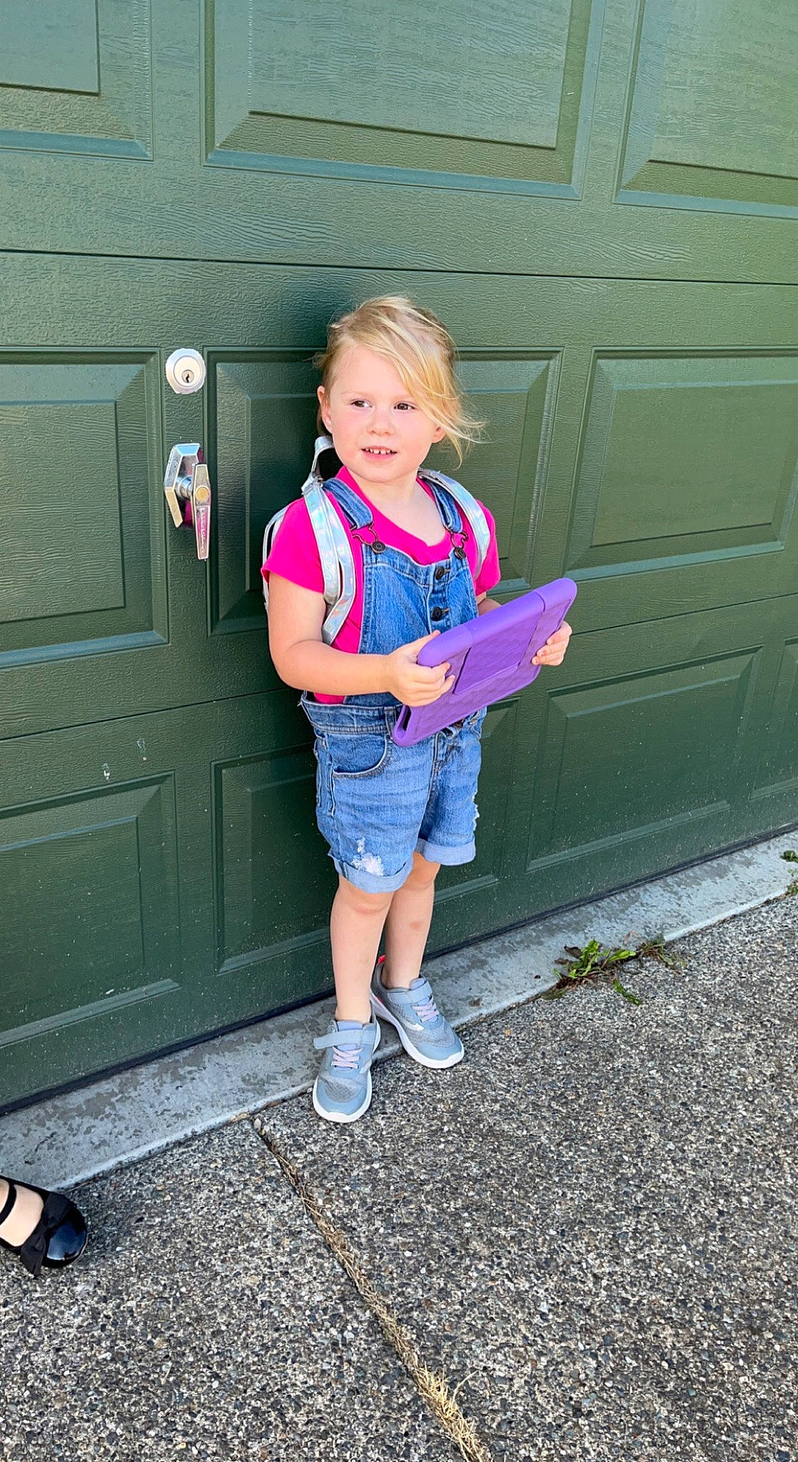Kennedi is registered to the contest to win money with this photo: blond, boot, child, denim, door, electric_blue, footwear, fun, human_leg, magenta, person, pink, purple, shoe, shorts, smile, sneakers, standing, toddler, vehicle_door