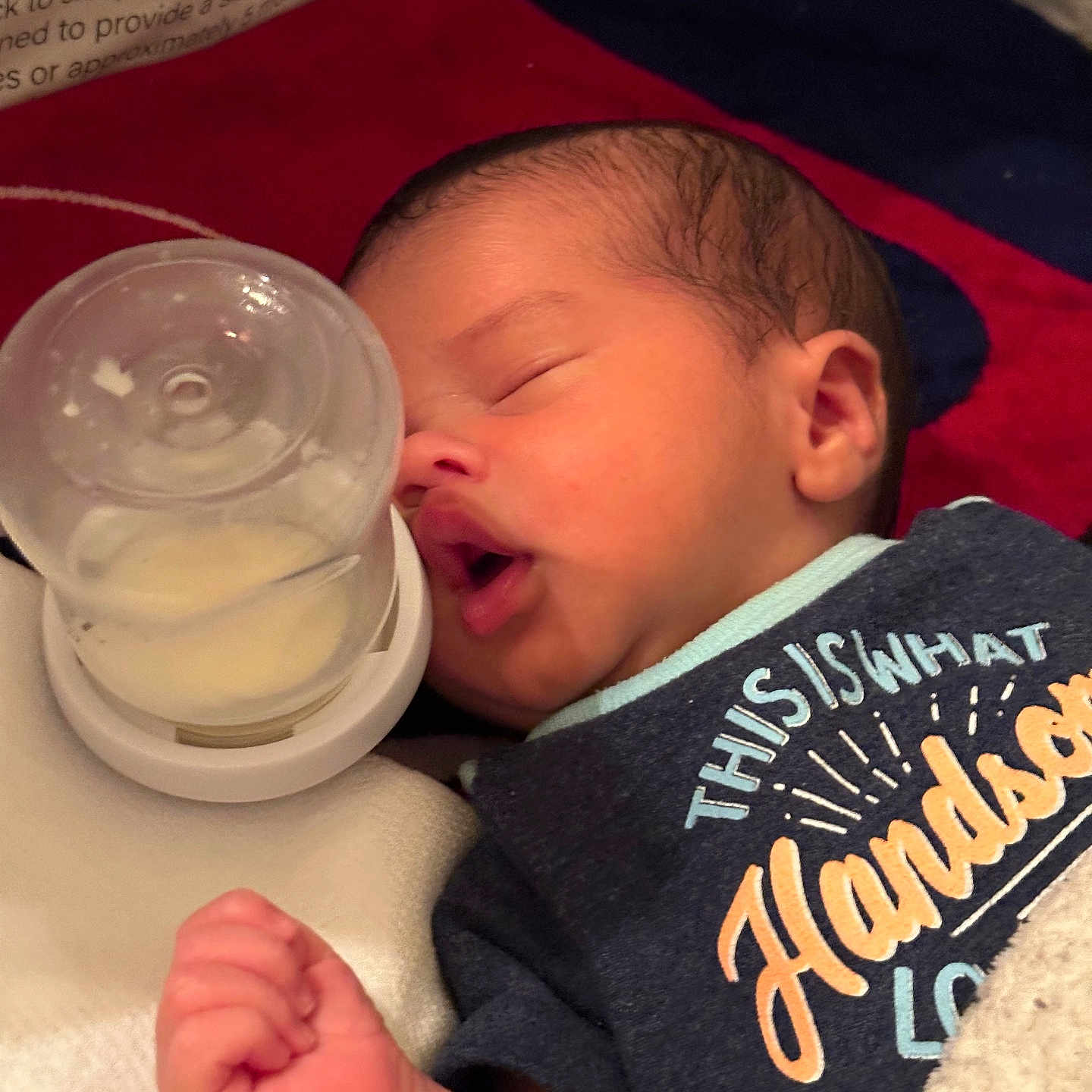 Nelmar is registered to the contest to win money with this photo: baby, bed, blanket, bottle, close_up, clothing, cozy, cute, face, hand, indoors, infant, mouth, newborn, peaceful, portrait, resting, sleeping, soft_lighting, young_child