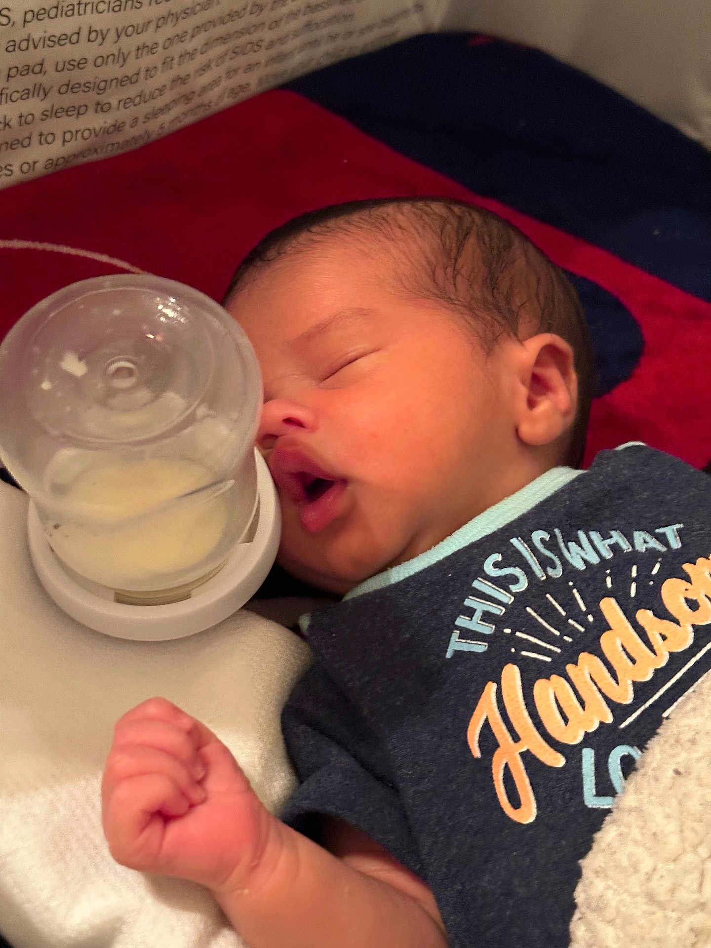 Nelmar is registered to the contest to win money with this photo: baby, bed, blanket, bottle, close_up, clothing, cozy, cute, face, hand, indoors, infant, mouth, newborn, peaceful, portrait, resting, sleeping, soft_lighting, young_child