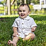 baby, child, grass, outdoor, smiling, happy, white_shirt, sitting, nature, greenery, cute, portrait, sunlight, infant, face, barefoot, park, daytime, young, buttoned_shirt