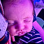 Aurora is registered to the contest to win money with this photo: baby, sleeping, close_up, face, chubby_cheeks, striped_clothing, monkey_design, hand, purple_light, peaceful, infant, soft_skin, eyelashes, cute, portrait, child, indoor, resting, young, adorable