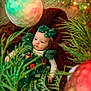 baby, child, christmas, holiday, green_dress, bow, ornament, christmas_tree, decoration, red_blanket, festive, holiday_season, infant, portrait, cute, celebration, indoor, seasonal, smiling, soft_lighting