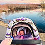 Aurora is registered to the contest to win money with this photo: baby, stroller, blanket, bottle, hand, path, lake, water, sunset, sky, trees, reflection, nature, outdoor, peaceful, crochet, purple, pink, person, landscape