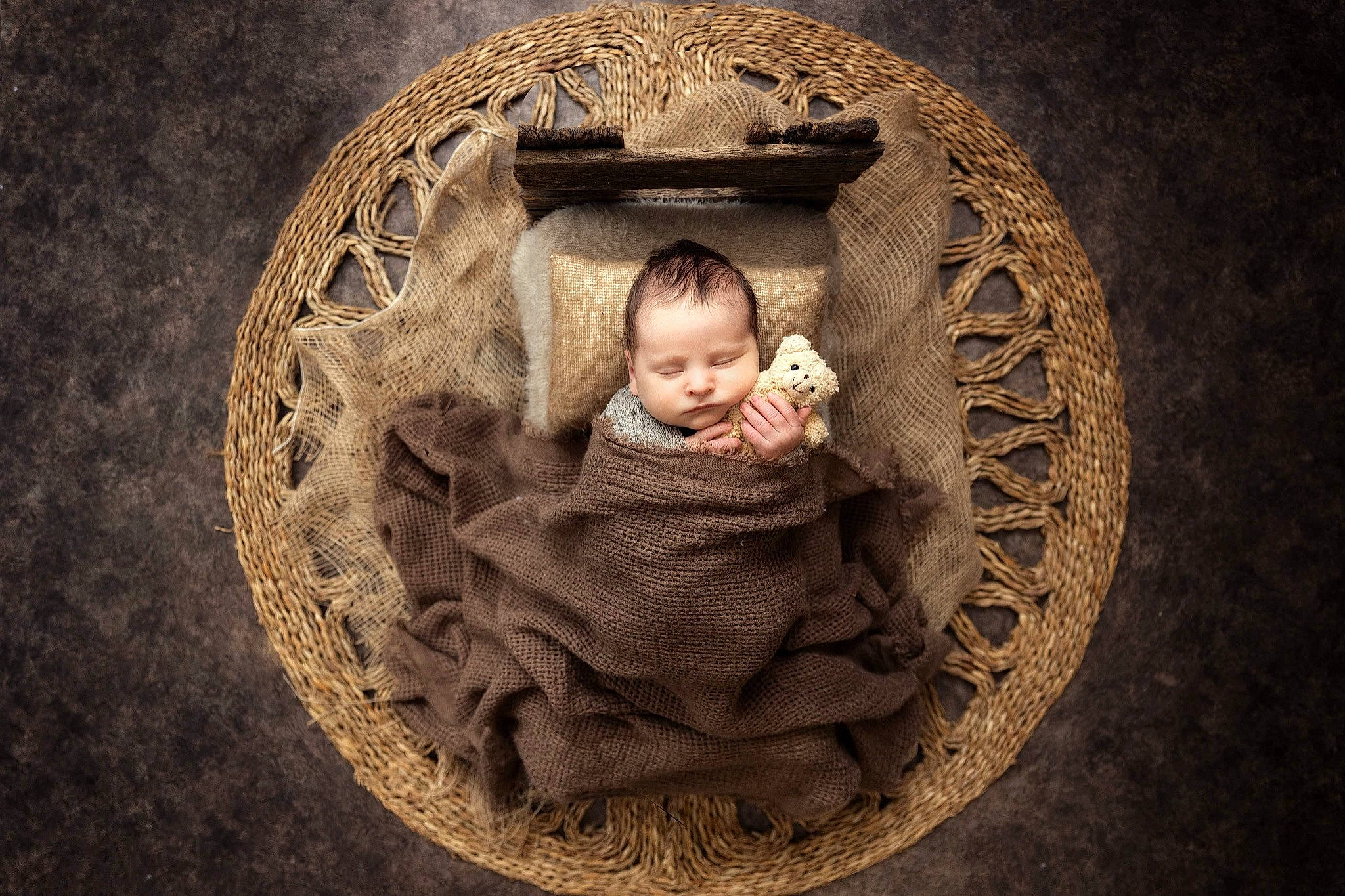 Ashton is registered to the contest to win money with this photo: art, artifact, baby, carving, child, circle, darkness, flash_photography, flooring, font, headgear, monochrome_photography, pattern, person, portrait_photography, sitting, still_life_photography, stone_carving, toddler, visual_arts