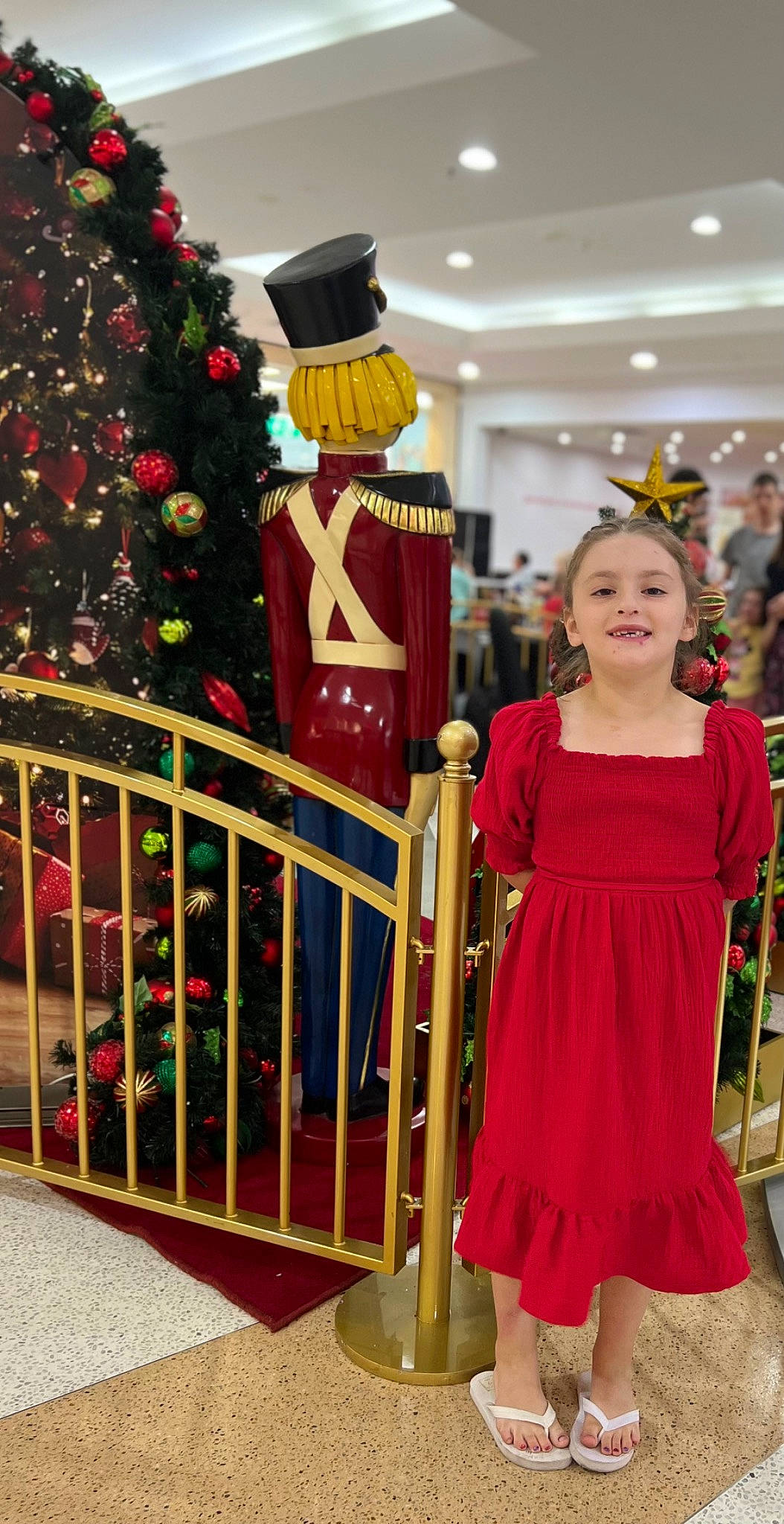 Alexis joined the competition — help win amazing prizes! christmas_decoration, christmas_ornament, christmas_tree, day_dress, event, fashion_design, formal_wear, fun, happy, holiday, holiday_ornament, joy, one_piece_garment, ornament, person, red, smile, standing, toy, tradition