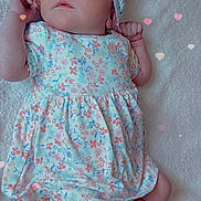 Melliana is registered to the contest to win money with this photo: baby, infant, child, floral_dress, headband, blanket, lying_down, cute, heart_overlay, soft_texture, pastel_colors, socks, portrait, adorable, newborn, peaceful, indoor, young_child, baby_girl, cozy