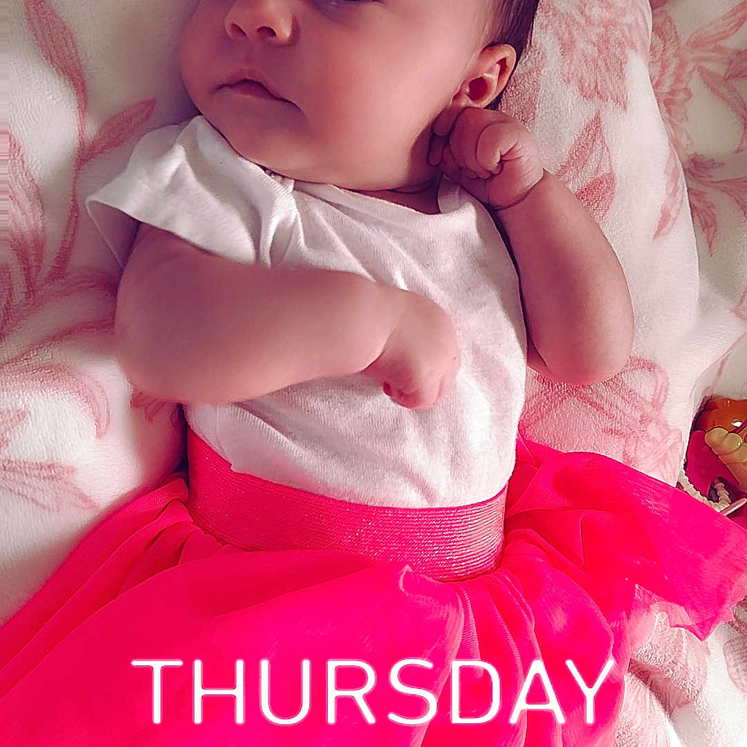 Melliana is registered to the contest to win money with this photo: baby, infant, tutu_skirt, pink, white_shirt, blanket, soft, lying_down, cute, curious, indoors, child, young, clothing, portrait, small_person, skin, face, legs, feet