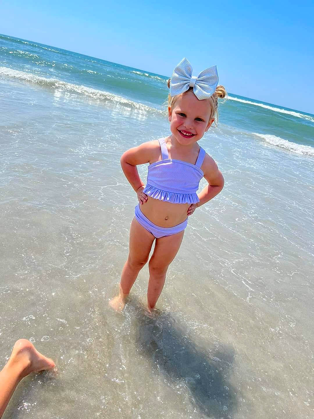 Jaslynn joined the competition — help win amazing prizes! barefoot, beach, fun, happy, hat, headwear, holiday, joy, leisure, one_piece_swimsuit, people_on_beach, person, personal_protective_equipment, recreation, sand, sky, smile, swimwear, thigh, toddler