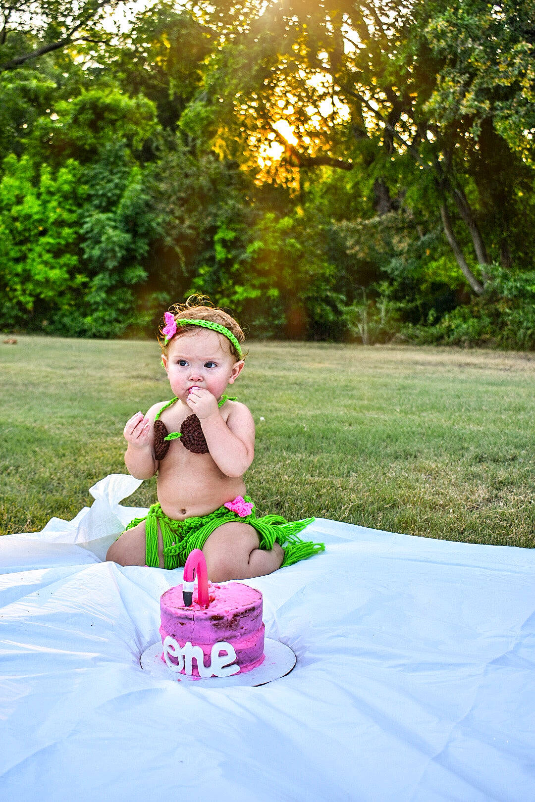 Viktoria is registered to the contest to win money with this photo: baby, child, dress, grass, green, happy, headgear, leisure, person, photo_shoot, photograph, photography, pink, plant, recreation, red, smile, summer, sunlight, toddler