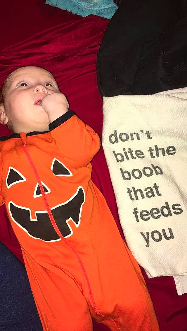 Viktoria is registered to the contest to win money with this photo: child, orange, outerwear, person, t_shirt