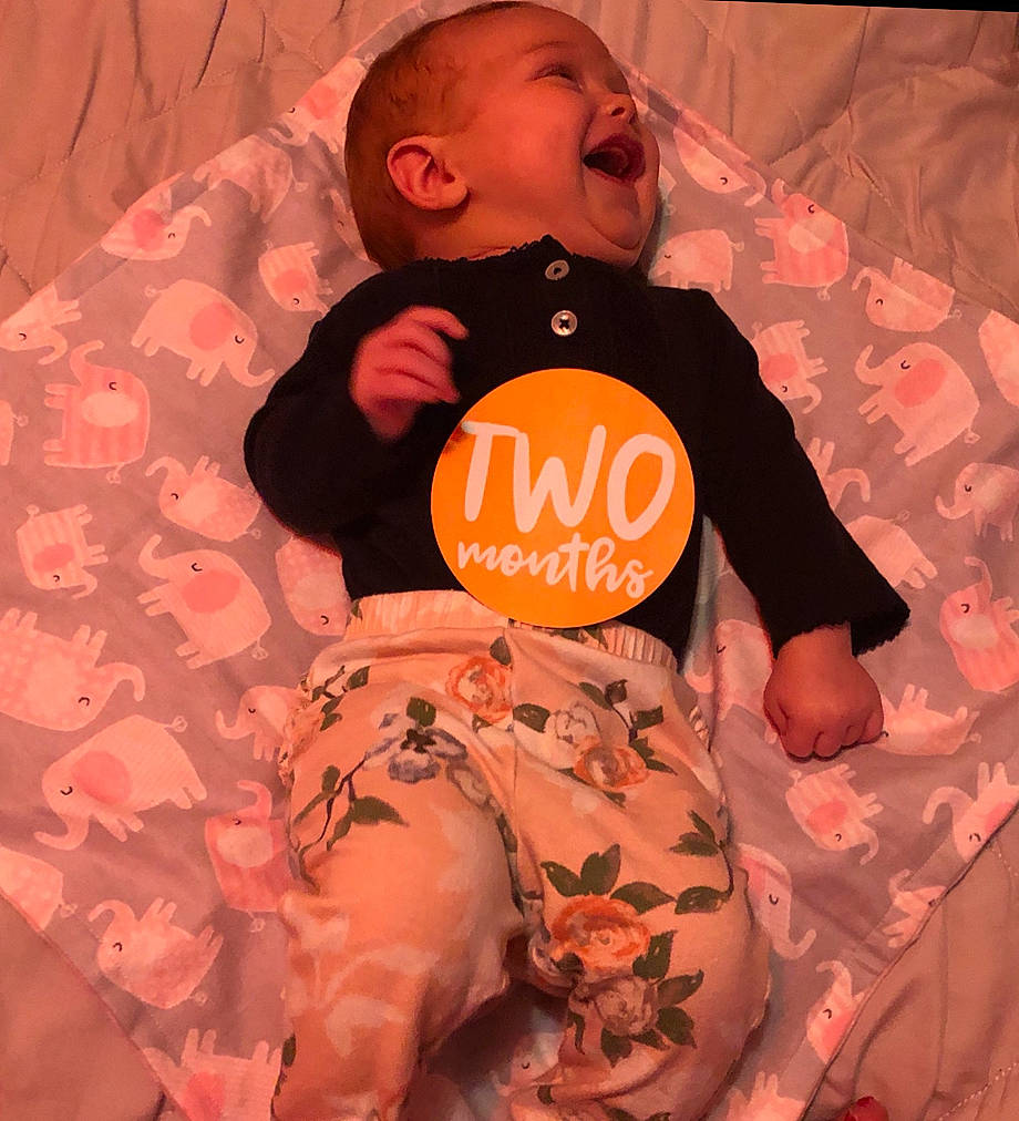 Viktoria is registered to the contest to win money with this photo: baby, child, headwear, orange, peach, person, pink, textile