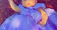 Blakeleigh joined the competition — help win amazing prizes! baby, infant, child, portrait, lying_down, lavender_dress, flower_headband, purple, straw, outdoor, sunlight, fashion, tulle, lace, bow, serious_expression, barefoot, sock, nature, photography
