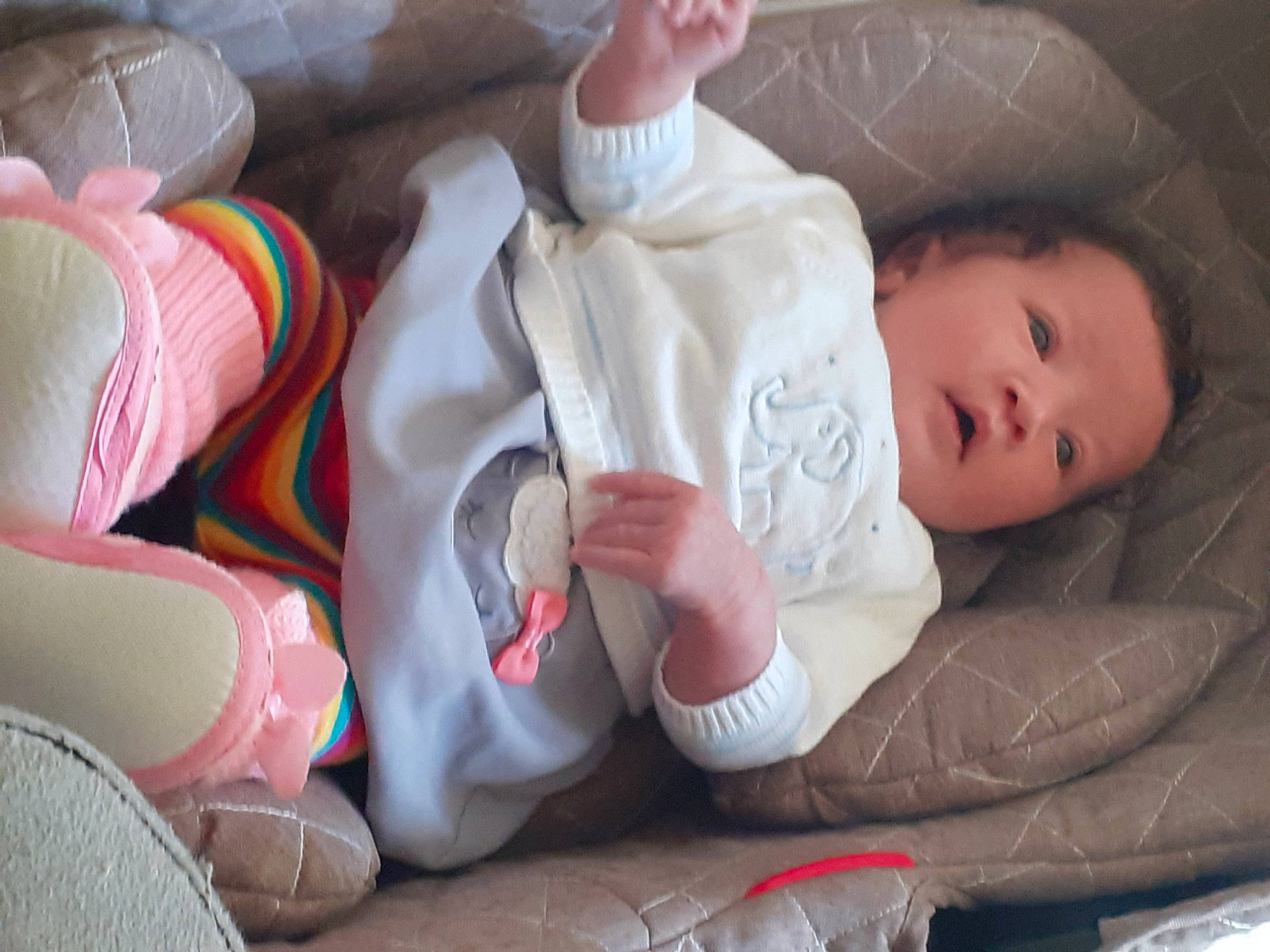 Layanna participe au concours pour gagner de l'argent avec cette photo : baby, baby_products, baby_sleeping, baby_toddler_clothing, carmine, cheek, child, comfort, finger, hand, head, headgear, human_body, linens, nose, person, sitting, skin, textile, toddler