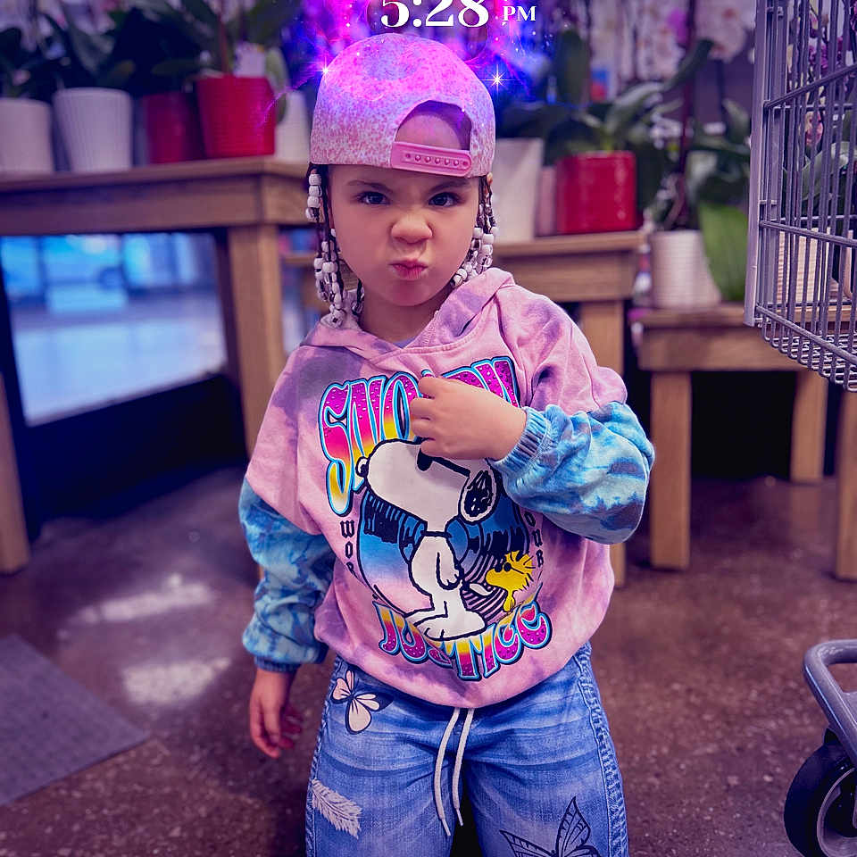 Harlie is registered to the contest to win money with this photo: accessories, bodypart, boy, cap, child, clothing, face, finger, flower, flowerarrangement, hand, hat, head, male, pants, person, photography, plant, portrait, purple