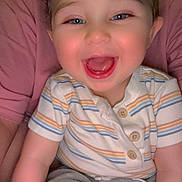 Adriel is registered to the contest to win money with this photo: baby, child, smile, happy, person, face, blue_eyes, striped_shirt, grey_pants, sitting, cute, joyful, infant, human, portrait, indoor, casual_clothing, mouth_open, short_hair, skin