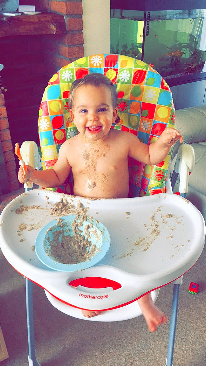 Scarlett-rose is registered to the contest to win money with this photo: baby, baby_food, birthday, child, eating, food, joy, person, play, tableware, toddler