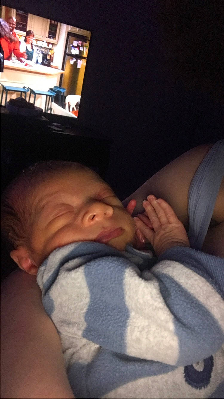 Amir is registered to the contest to win money with this photo: abdomen, baby, cheek, child, comfort, couch, elbow, finger, gesture, human_leg, linens, mouth, nose, person, room, shelf, shoulder, sitting, skin, thumb