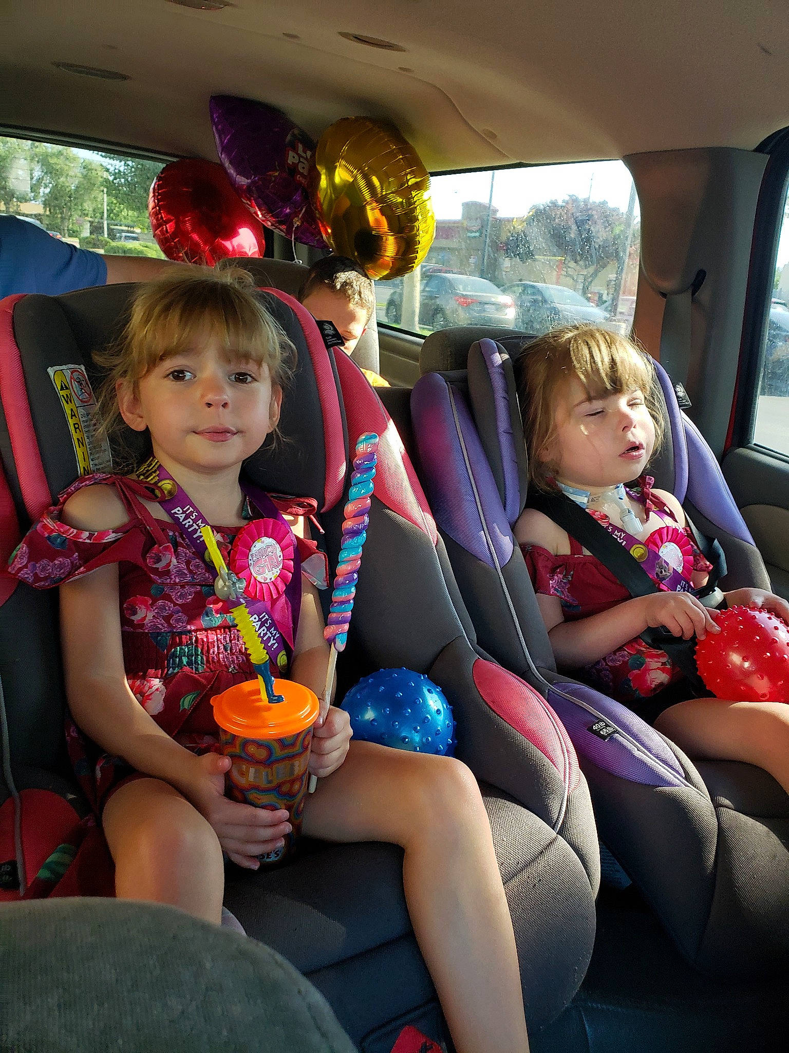 Odessa is registered to the contest to win money with this photo: auto_part, car, car_seat, child, family_car, fun, luxury_vehicle, passenger, person, sitting, toddler, vacation, vehicle