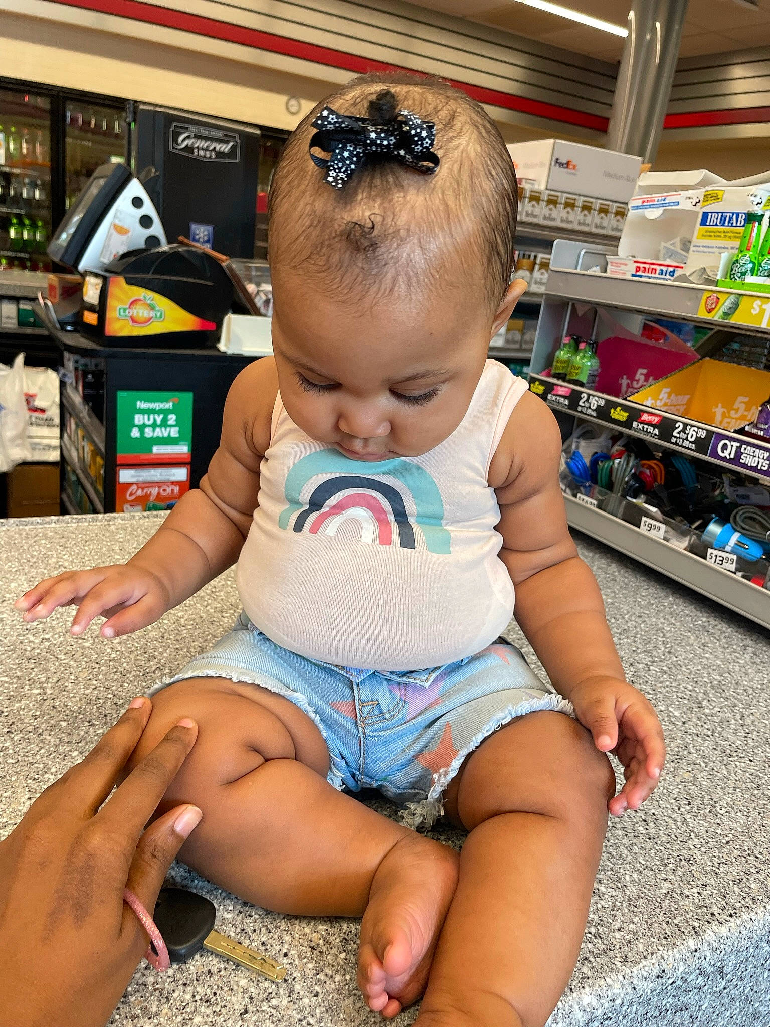 Asia is registered to the contest to win money with this photo: baby, baby_toddler_clothing, barefoot, beauty, child, foot, fun, hairstyle, happy, human_body, human_leg, joint, lap, leg, leisure, person, product, shorts, skin, thigh