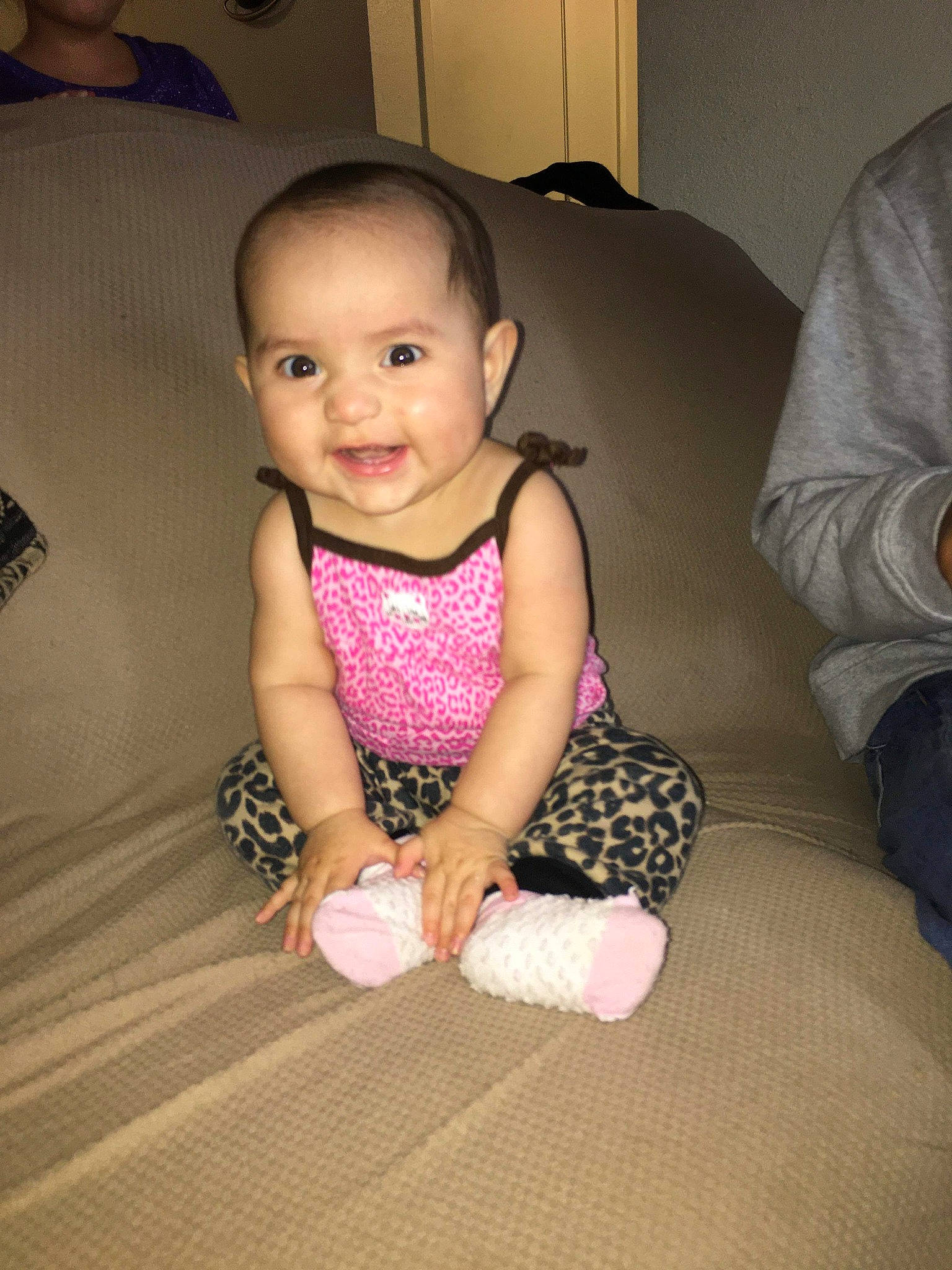 Angelica is registered to the contest to win money with this photo: baby, baby_toddler_clothing, cheek, child, dress, eye, floor, flooring, head, iris, joy, leg, pattern, person, pink, play, shoe, sitting, skin, smile