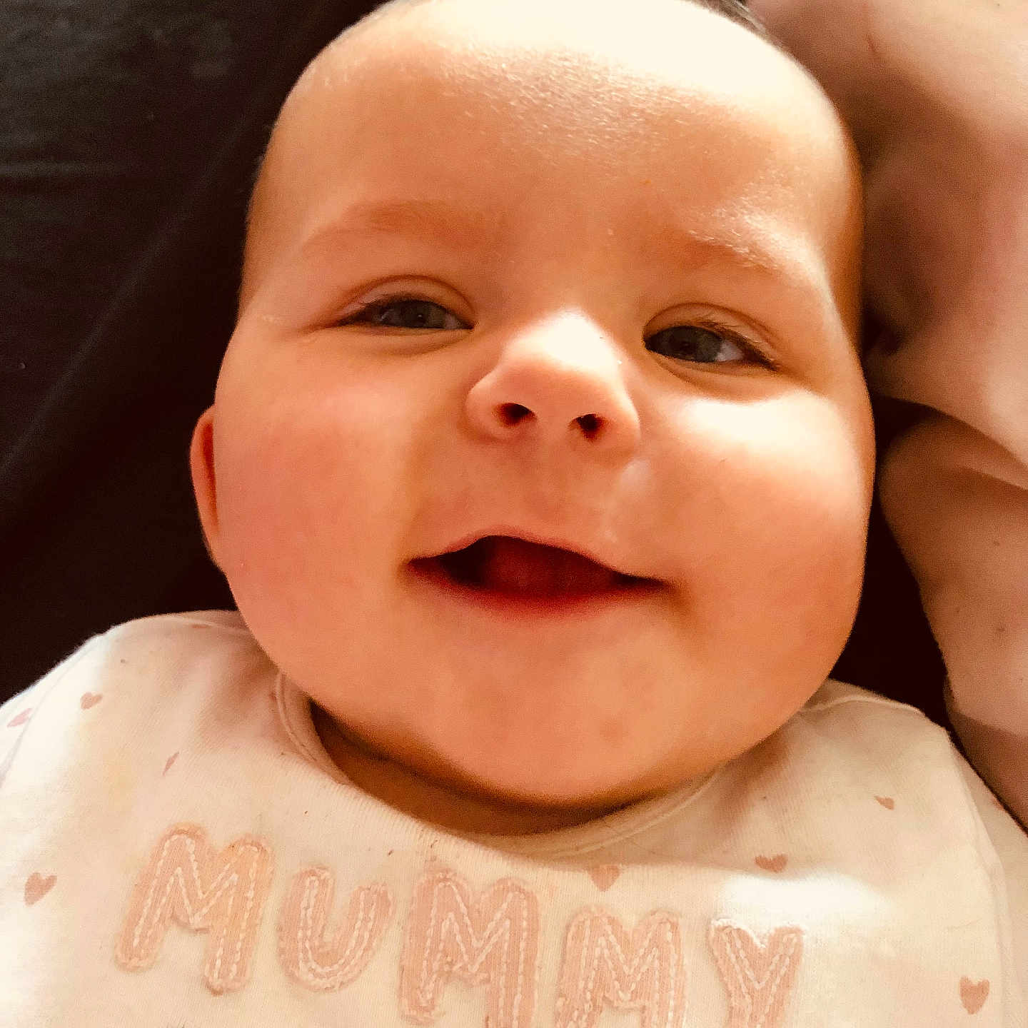 Scarborough is registered to the contest to win money with this photo: accessories, baby, babylaughing, bodypart, cushion, face, happy, head, homedecor, jewelry, laughing, mouth, necklace, newborn, person, photography, portrait, selfie, smile, teeth