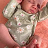 baby, newborn, sleeping, onesie, floral_pattern, feet, hand, infant, skin, closeup, peaceful, pink, coral, blanket, cute, child, portrait, soft, resting, relaxed