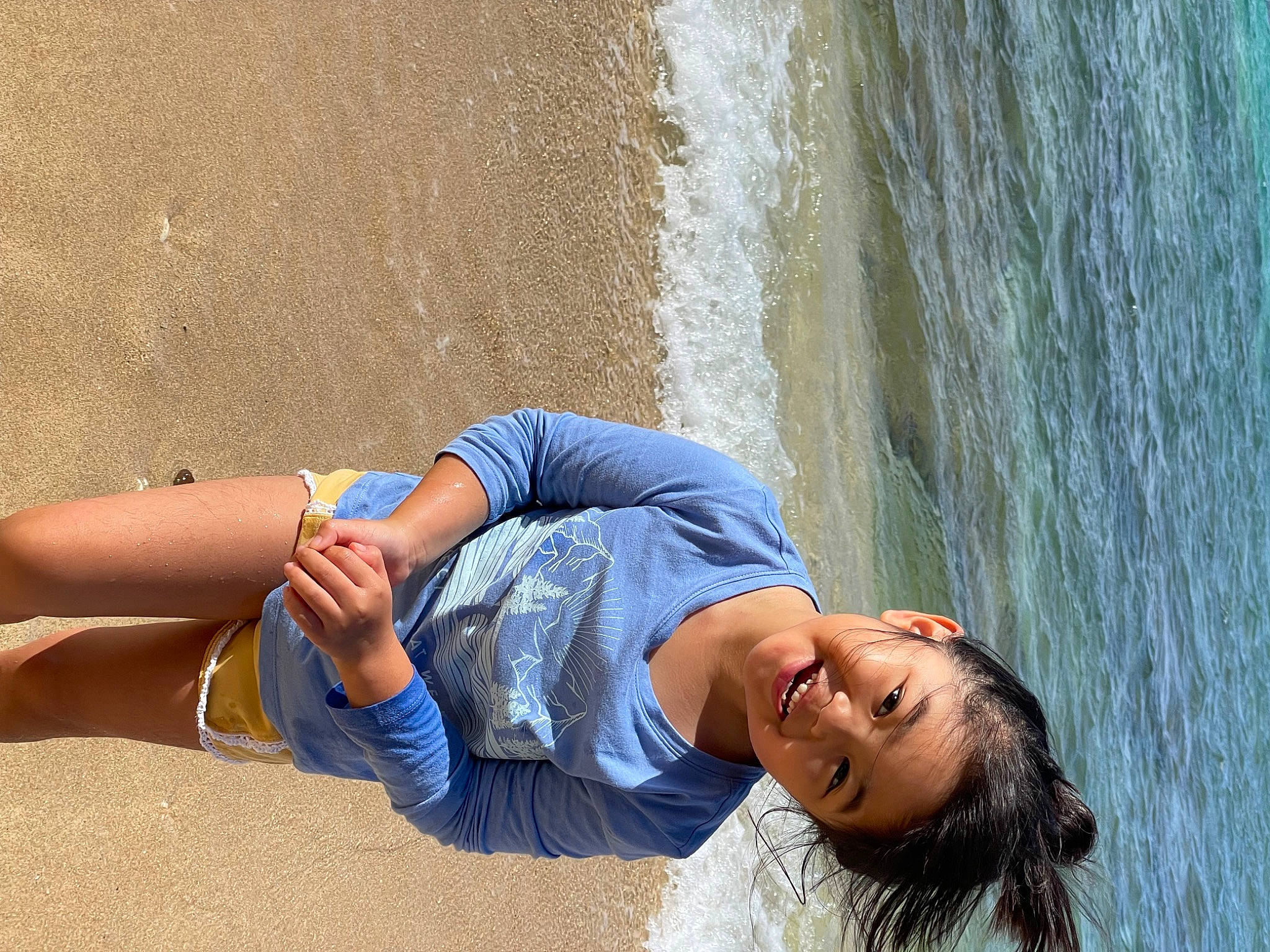 Peyton is registered to the contest to win money with this photo: azure, barefoot, beach, denim, elbow, fun, hand, happy, human_leg, joint, joy, knee, lake, leisure, people_in_nature, person, summer, thigh, tree, waist