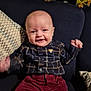 Arley-Bowe joined the competition — help win amazing prizes! baby, smiling, plaid_shirt, maroon_pants, couch, pillow, floral_curtain, indoor, child, happy, seated, infant, clothing, face, person, home, portrait, cute, young, cheerful