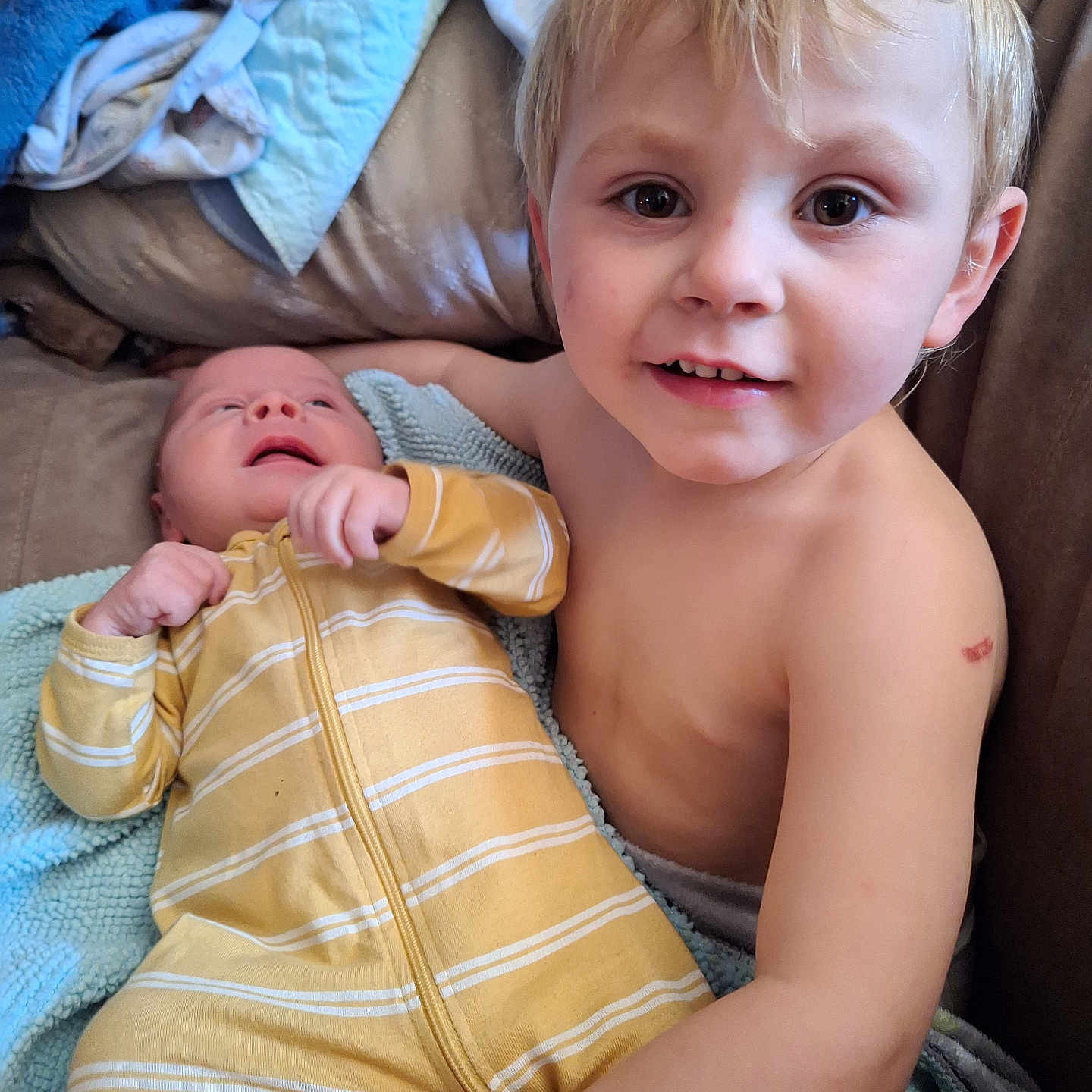 Quintin Oliver is registered to the contest to win money with this photo: baby, bed, bedroom, blanket, bodypart, couch, cushion, face, finger, furniture, hand, head, homedecor, indoors, newborn, person, photography, portrait, room, towel