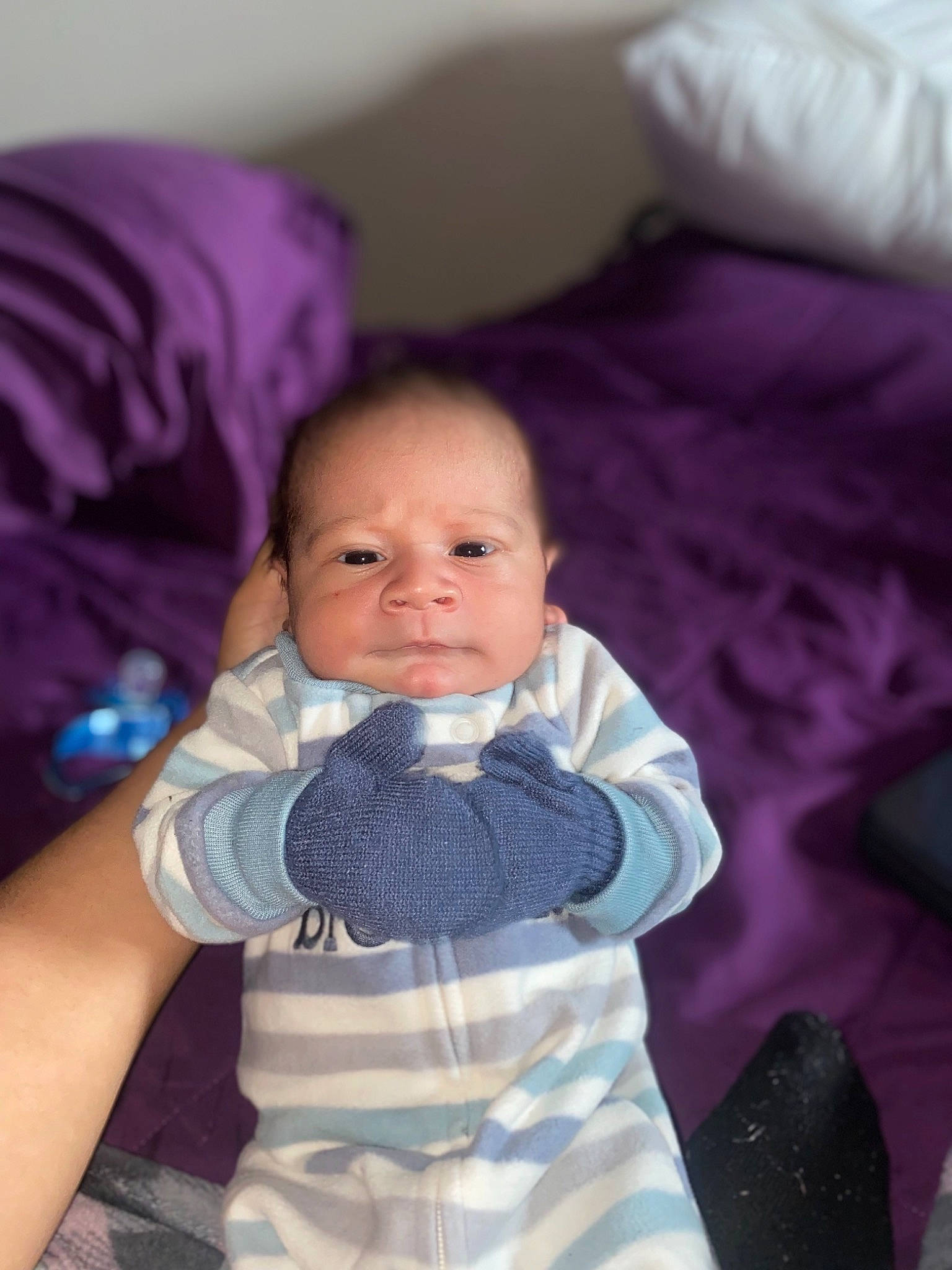 Manuel Elias is registered to the contest to win money with this photo: baby, baby_toddler_clothing, cheek, child, comfort, electric_blue, finger, gesture, happy, linens, mouth, nose, person, pink, purple, skin, sleeve, smile, textile, toddler