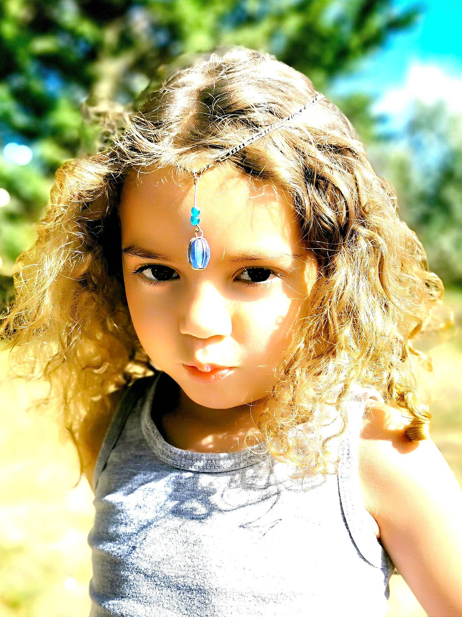 Giuliana a rejoint le concours — aidez-le/la à gagner de superbes lots ! cheek, child, chin, doll, eye, eyebrow, eyelash, fawn, grass, happy, head, iris, lip, nose, people_in_nature, person, skin, sunlight, toy, tree