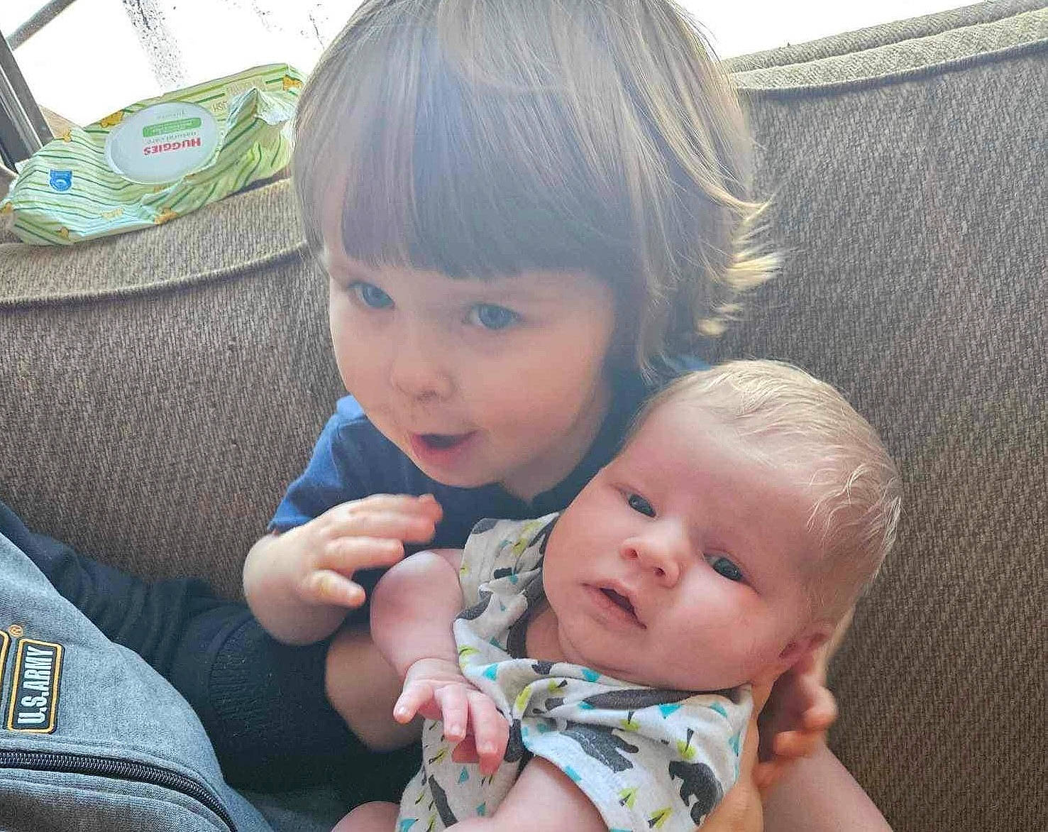 Killian joined the competition — help win amazing prizes! baby, baby_toddler_clothing, beauty, cheek, child, comfort, face, facial_expression, gesture, grass, happy, head, mammal, nose, person, product, sharing, sitting, skin, thumb