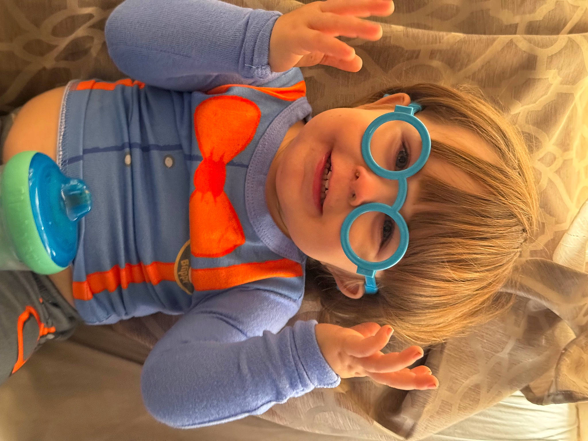 Killian joined the competition — help win amazing prizes! baby, baby_toddler_clothing, child, comfort, cool, electric_blue, eyelash, eyewear, finger, fun, goggles, hearing, leisure, mouth, orange, person, personal_protective_equipment, sunglasses, toddler, vision_care