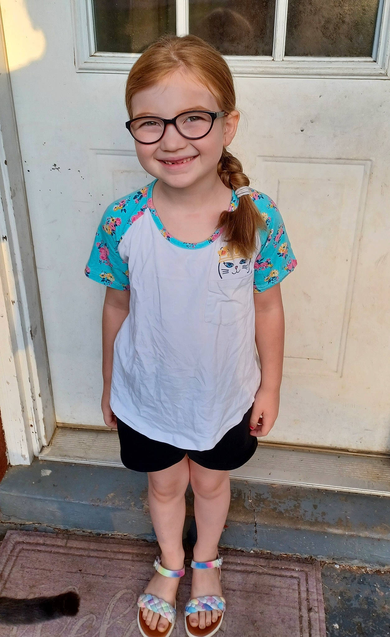 Sophia is registered to the contest to win money with this photo: azure, electric_blue, eyewear, facial_expression, glasses, hair, happy, head, joint, joy, knee, neck, person, shoulder, sleeve, smile, standing, summer, t_shirt, thigh