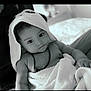 Sanji Maleappa participe au concours pour gagner de l'argent avec cette photo : baby, black_and_white, blanket, child, closeup, comfort, cute, cuteness, expression, face, hood, indoor, infant, person, portrait, resting, skin, soft, towel, young
