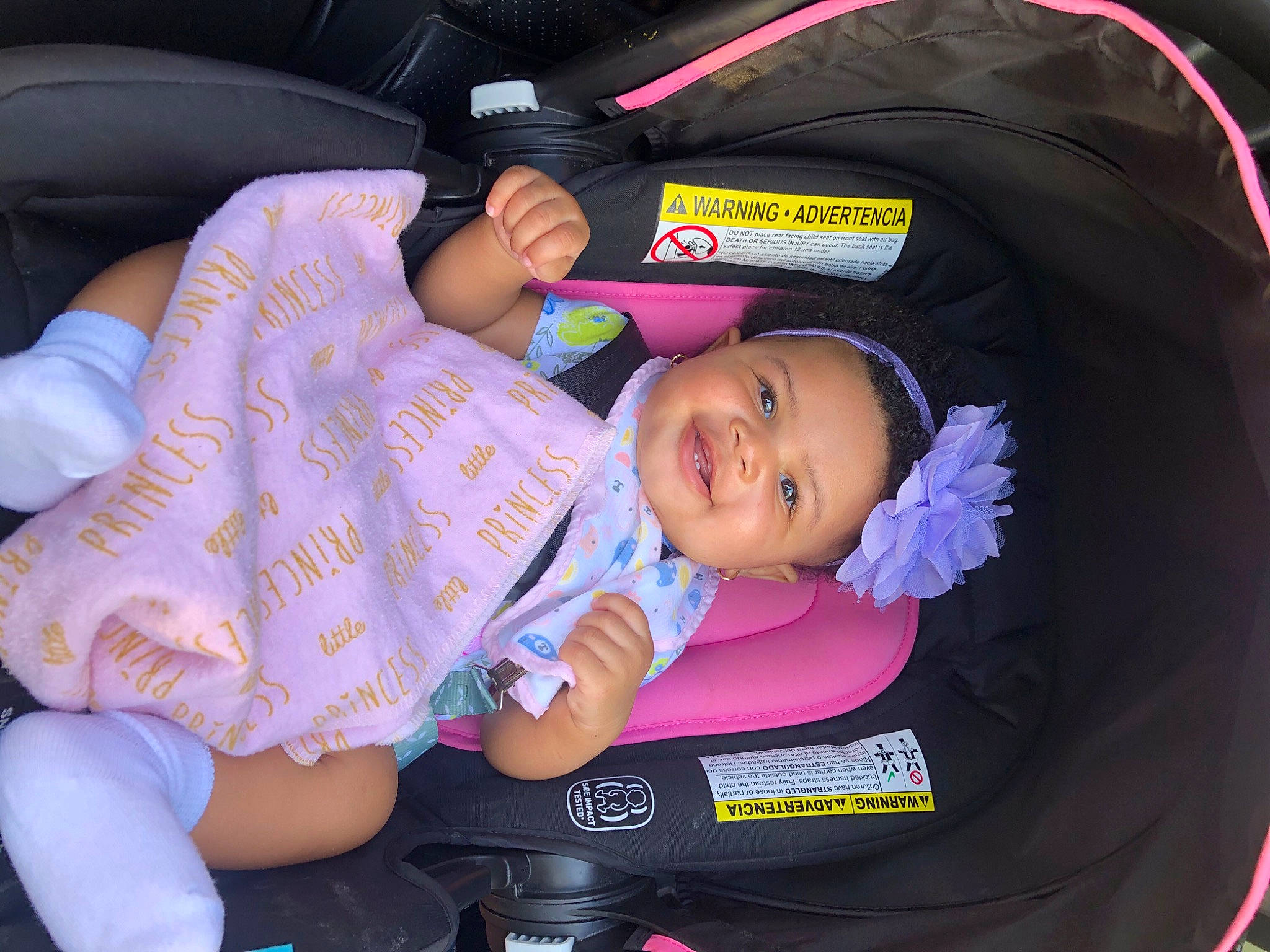 India Grace is registered to the contest to win money with this photo: auto_part, baby, baby_carriage, baby_products, baby_toddler_clothing, car_seat, child, comfort, fun, human_body, joy, lap, magenta, person, pink, product, purple, sitting, smile, thigh