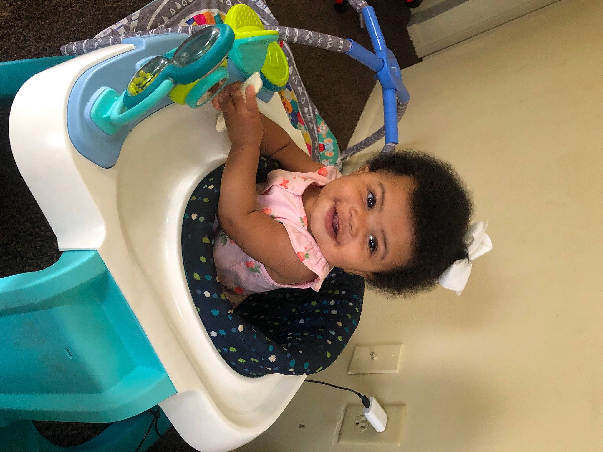 India Grace is registered to the contest to win money with this photo: automotive_design, baby, baby_products, baby_toddler_clothing, baby_toys, child, fun, happy, joy, leisure, person, play, recreation, room, smile, thigh, toddler, toy, toy_vehicle