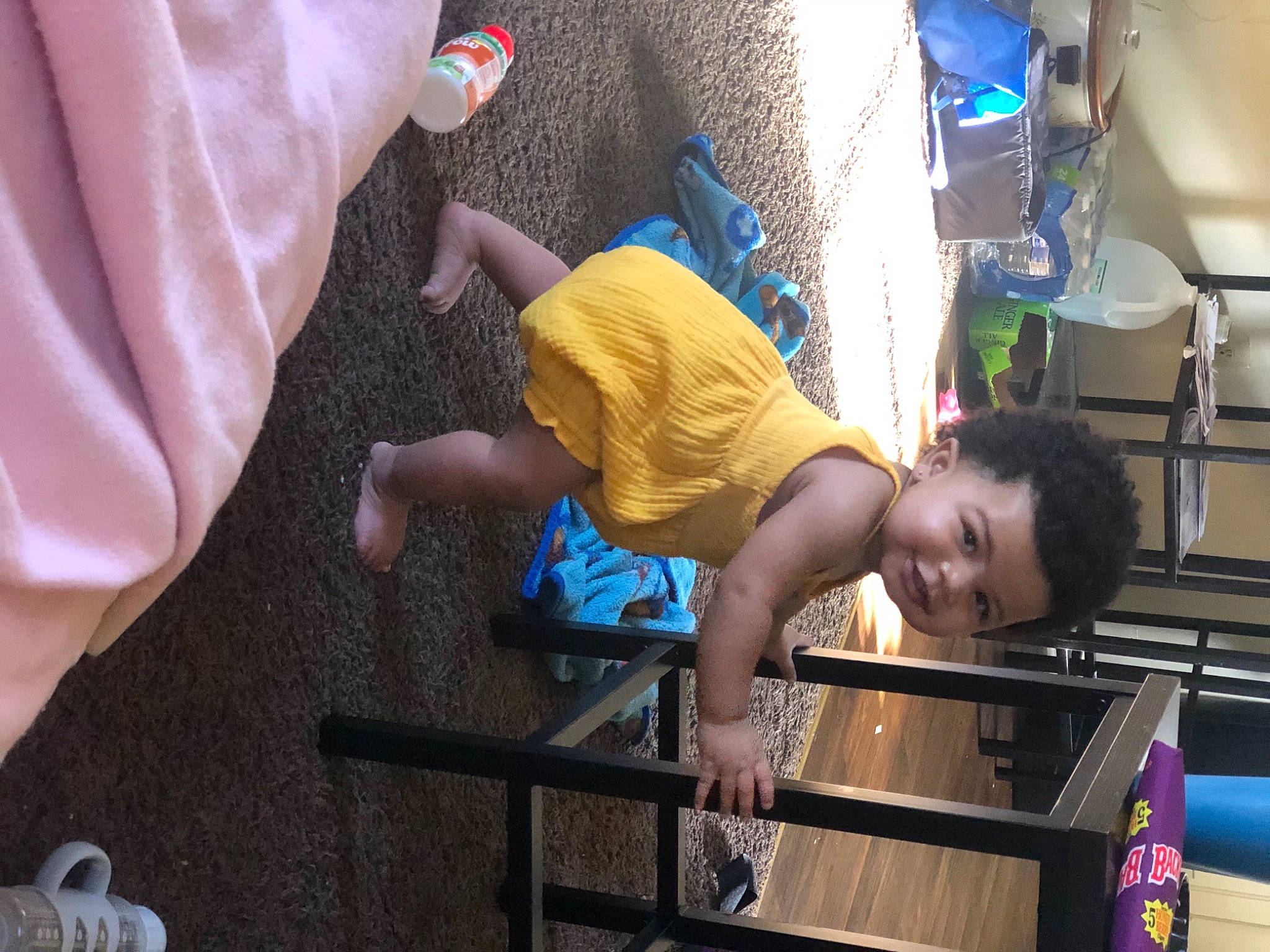 India Grace is registered to the contest to win money with this photo: child, elbow, electric_blue, engineering, event, fun, human_leg, joint, knee, leisure, person, play, recreation, room, shorts, smile, t_shirt, thigh, toddler, vacation