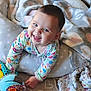 Leyna participe au concours pour gagner de l'argent avec cette photo : baby, smiling, crawling, plush_toy, blanket, pillow, onesie, indoor, child, happy, face, head, carpet, soft_toys, colorful_clothing, infant, home, cute, cozy, playful