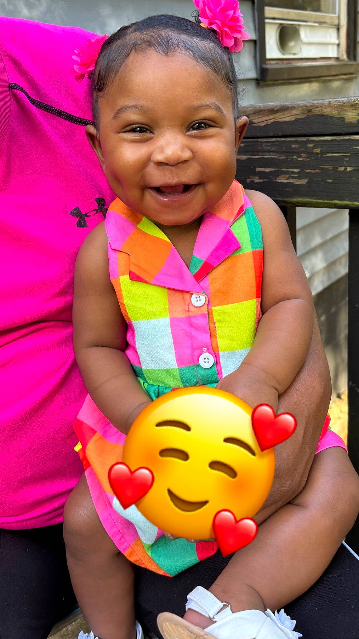 Kalani is registered to the contest to win money with this photo: arm, baby_toddler_clothing, cheek, eye, facial_expression, finger, fun, gesture, hand, happy, joy, lip, mouth, nose, orange, organ, person, pink, red, skin