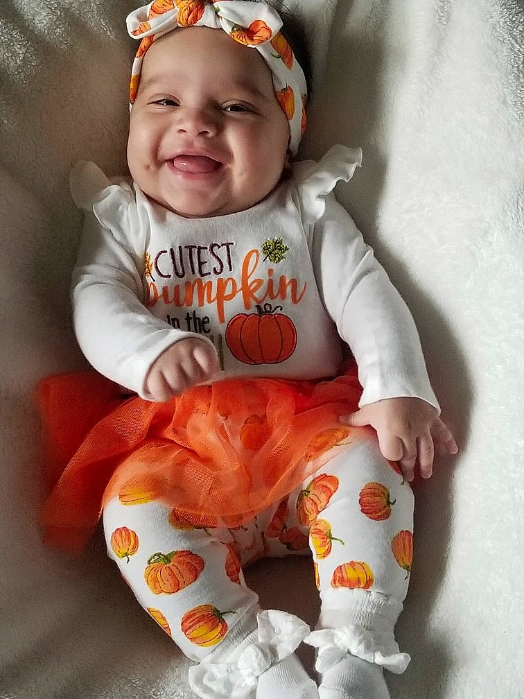 Moon Jade joined the competition — help win amazing prizes! arm, baby, baby_toddler_clothing, comfort, face, facial_expression, happy, head, headwear, joy, orange, outerwear, pattern, person, pink, skin, sleeve, smile, t_shirt, textile