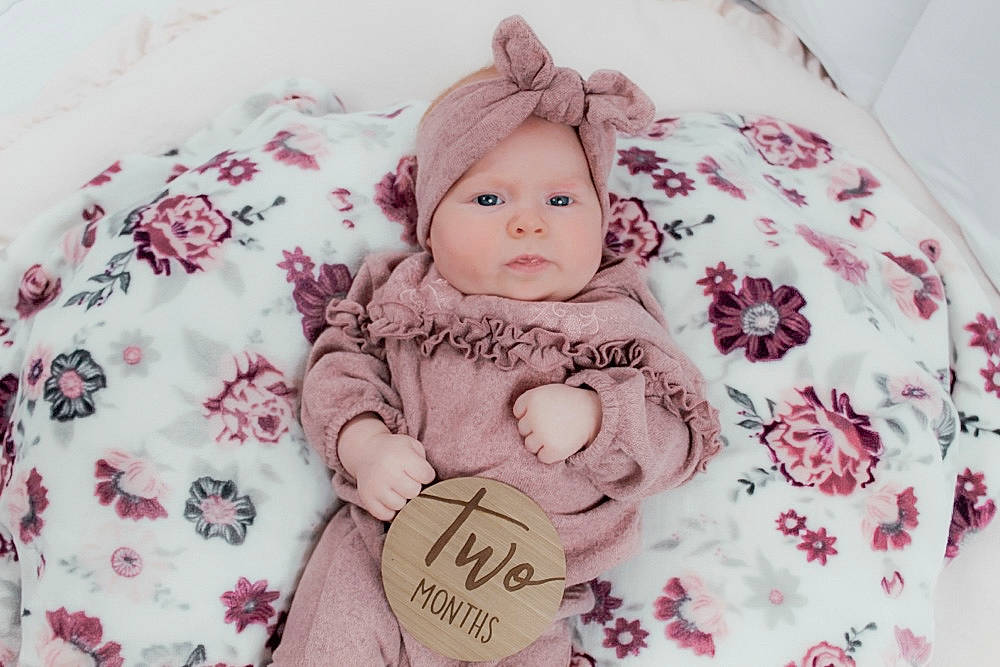 Mylah is registered to the contest to win money with this photo: baby, baby_sleeping, baby_toddler_clothing, cheek, child, clothing, comfort, head, headwear, knit_cap, linens, magenta, outerwear, pattern, person, pink, product, skin, sleeve, textile