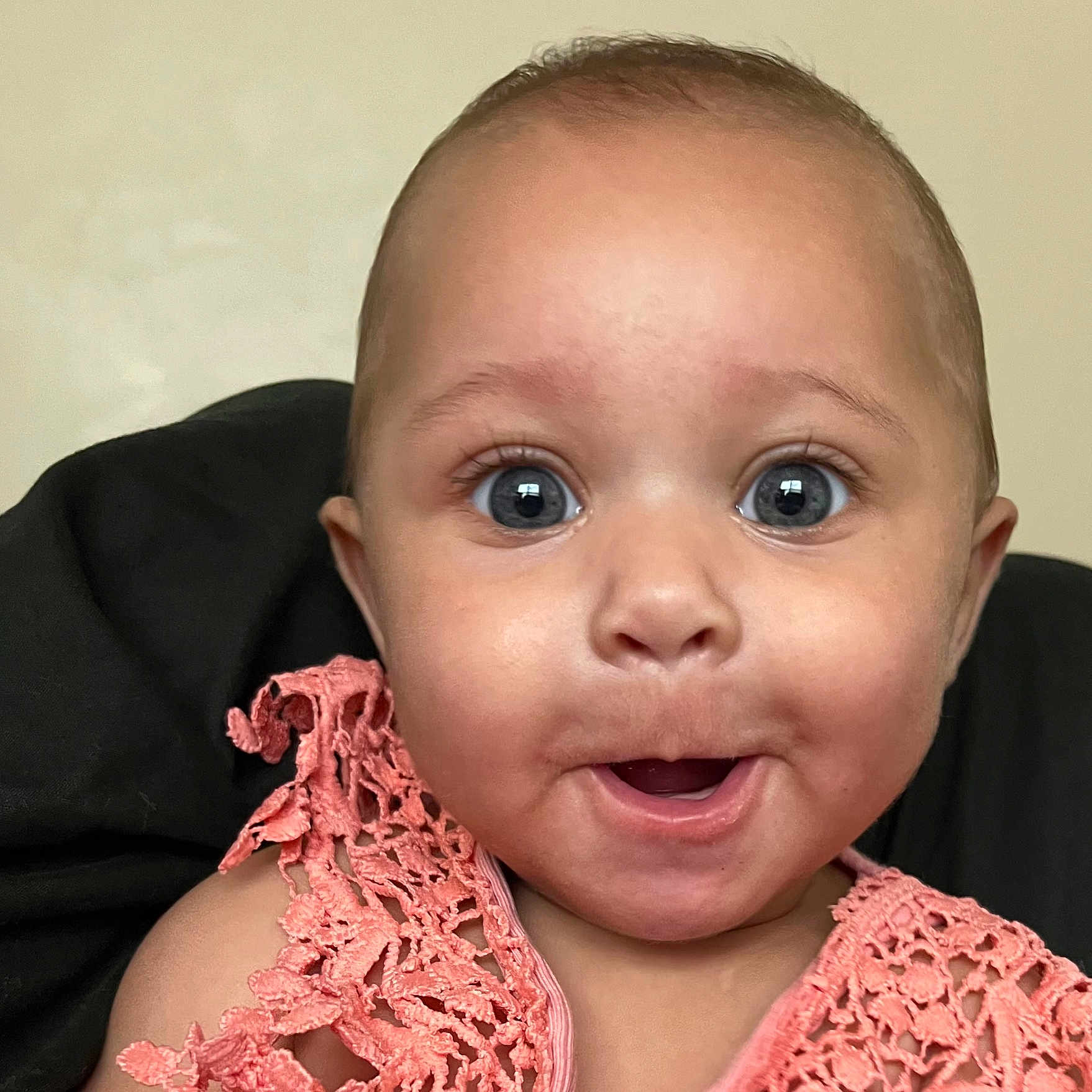 Kinsley joined the competition — help win amazing prizes! baby, child, face, eyes, mouth, expression, surprised, clothing, crochet, pink, portrait, closeup, skin, head, person, infant, cute, happy, indoors, background