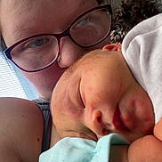 Freya is registered to the contest to win money with this photo: baby, person, glasses, sleeping, closeup, cuddle, indoor, window, blinds, skin, face, head, comfort, love, affection, child, gentle, peaceful, expression, human