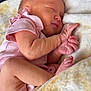 newborn, baby, sleeping, pink_onesie, blanket, pacifier, infant, cozy, peaceful, cute, child, resting, soft, skin, portrait, indoors, tiny_hands, closeup, comfort, warm