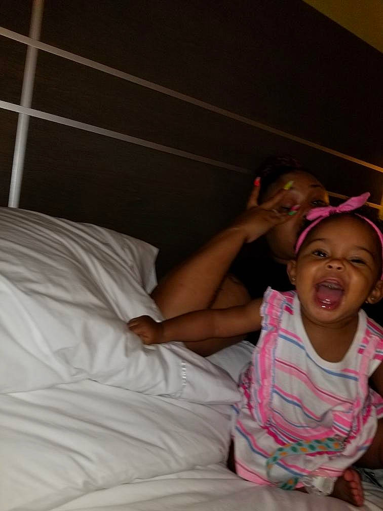 Jordynn joined the competition — help win amazing prizes! bed, bedtime, child, fun, linens, person, pink, room, skin, smile, textile, toddler, vacation