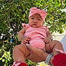 Elara Lucynn is registered to the contest to win money with this photo: baby, child, person, outdoor, greenery, tree, leaves, headband, red_booties, striped_outfit, hand, wristwatch, sky, sunlight, nature, infant, cute, portrait, holding, serious_expression