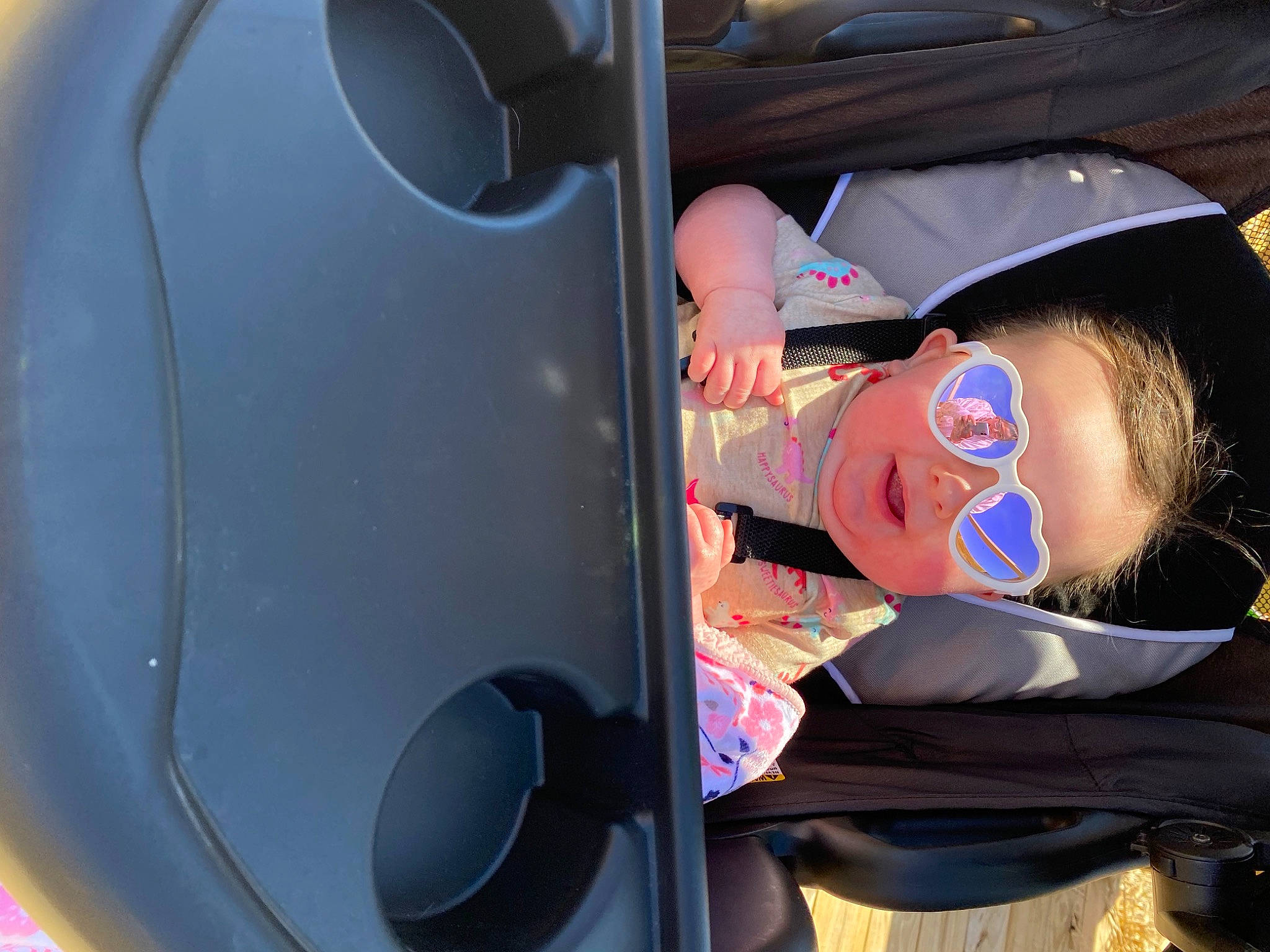 Ophelia is registered to the contest to win money with this photo: auto_part, automotive_design, automotive_exterior, automotive_lighting, automotive_tire, automotive_wheel_system, baby, bumper, car_seat, electric_blue, facial_expression, fender, fun, hat, motor_vehicle, person, product, rim, toddler, vehicle