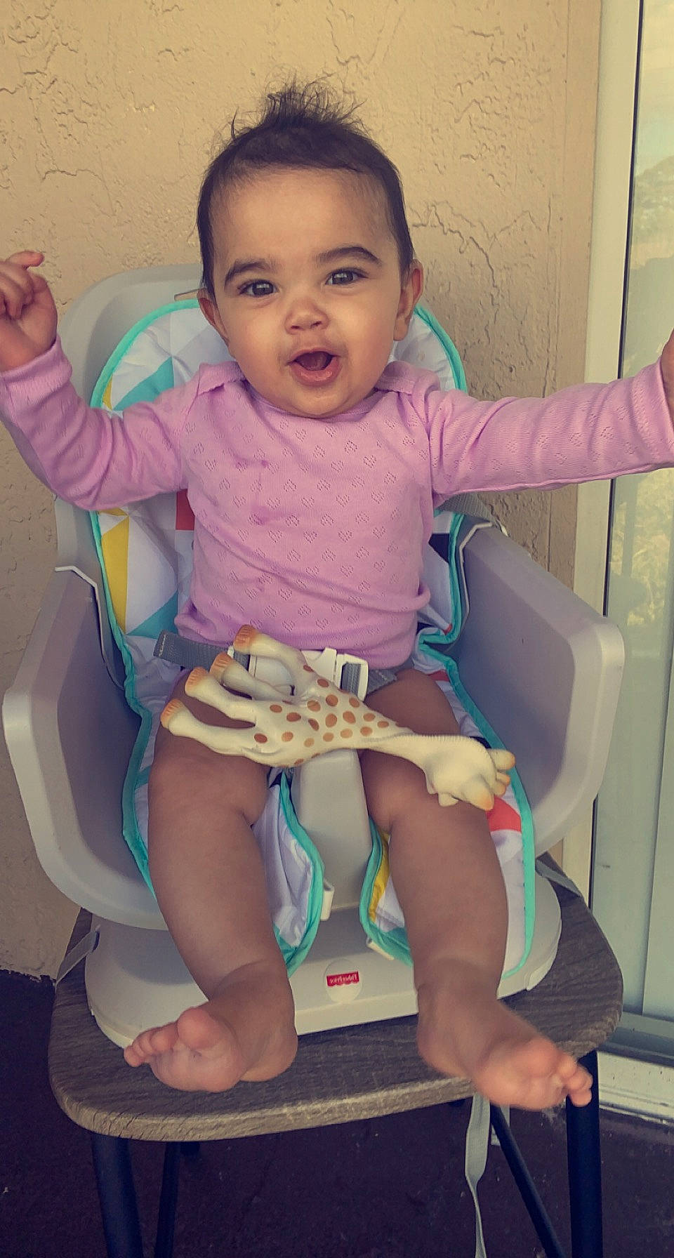 Sariyah is registered to the contest to win money with this photo: arm, baby_toddler_clothing, cheek, comfort, eyebrow, face, finger, gesture, hairstyle, hand, head, human_body, joint, leg, mouth, neck, person, product, purple, shoulder