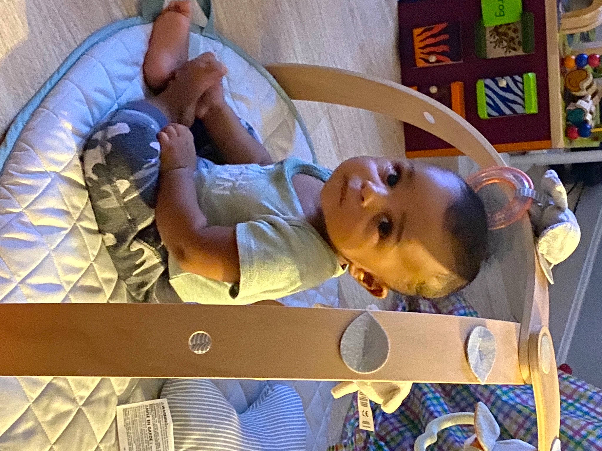 Judah is registered to the contest to win money with this photo: baby, child, comfort, elbow, eyewear, fun, happy, hat, leisure, mammal, person, room, shelf, sitting, toddler, vacation, wood